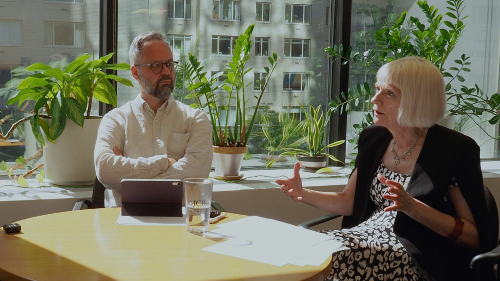 Rob O'Donnell and Susan King speak with Abhi Arun, CEO of TNQTech, on a sunny day at RUP's New York Office